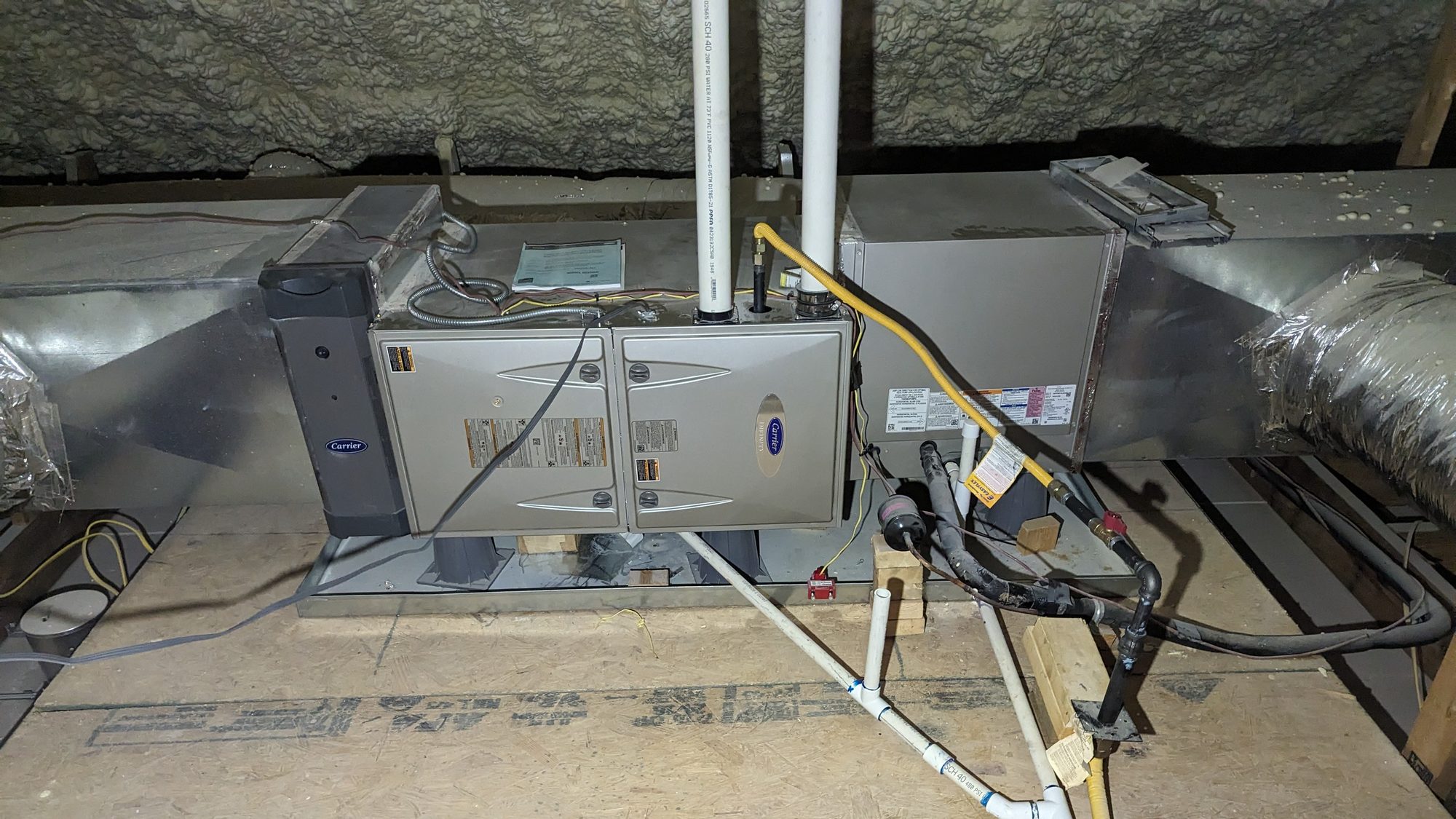 Carrier Infinity furnace system with an air purifier module installed alongside it