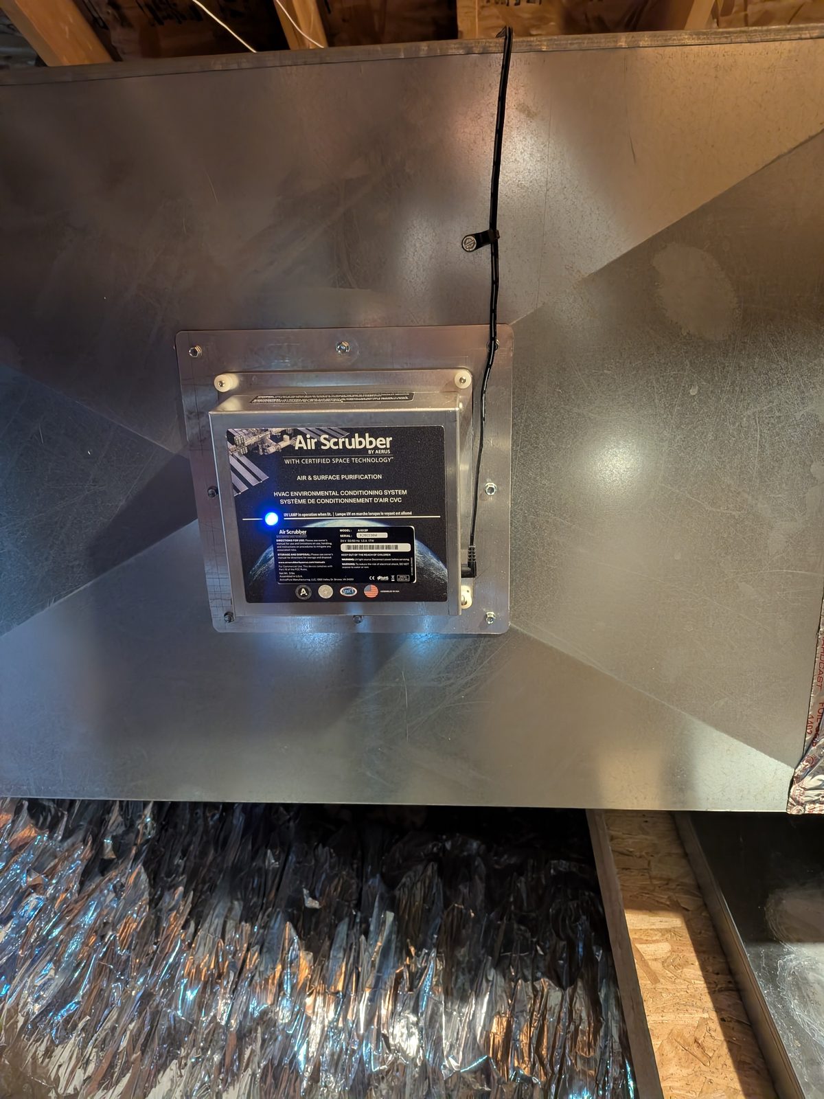 Air Scrubber by Aerus in-duct air and surface purification device mounted in the return plenum