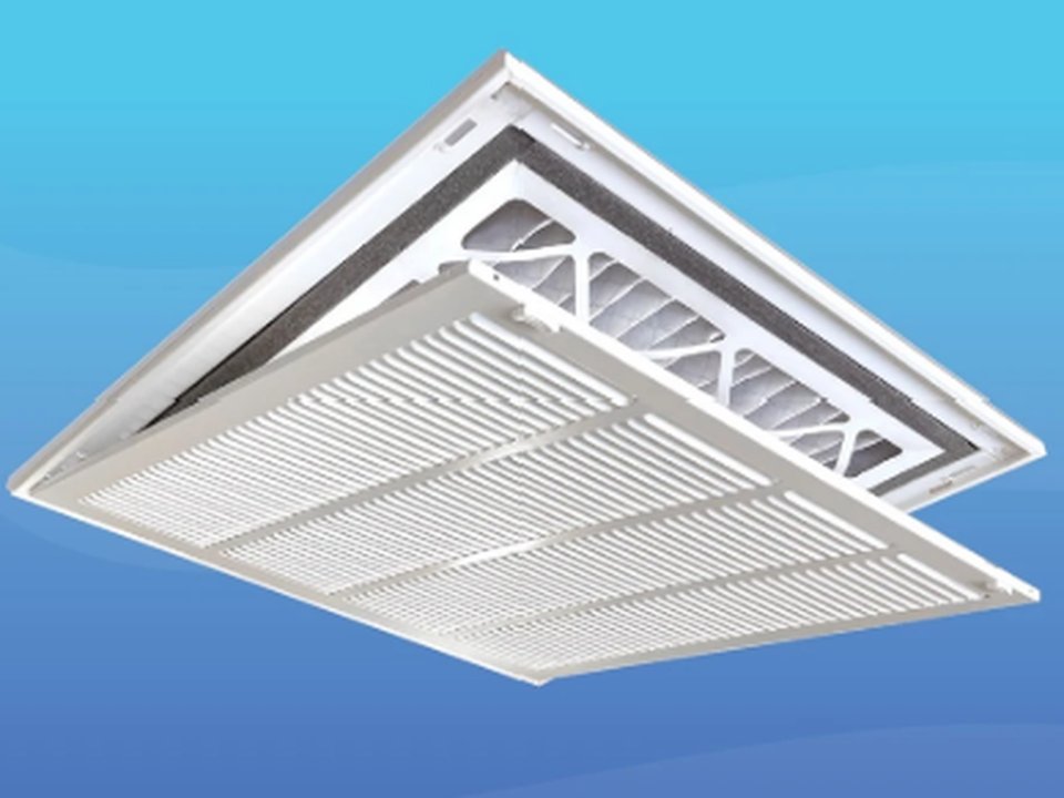Ceiling return-air grille opened to show a pleated filter in place