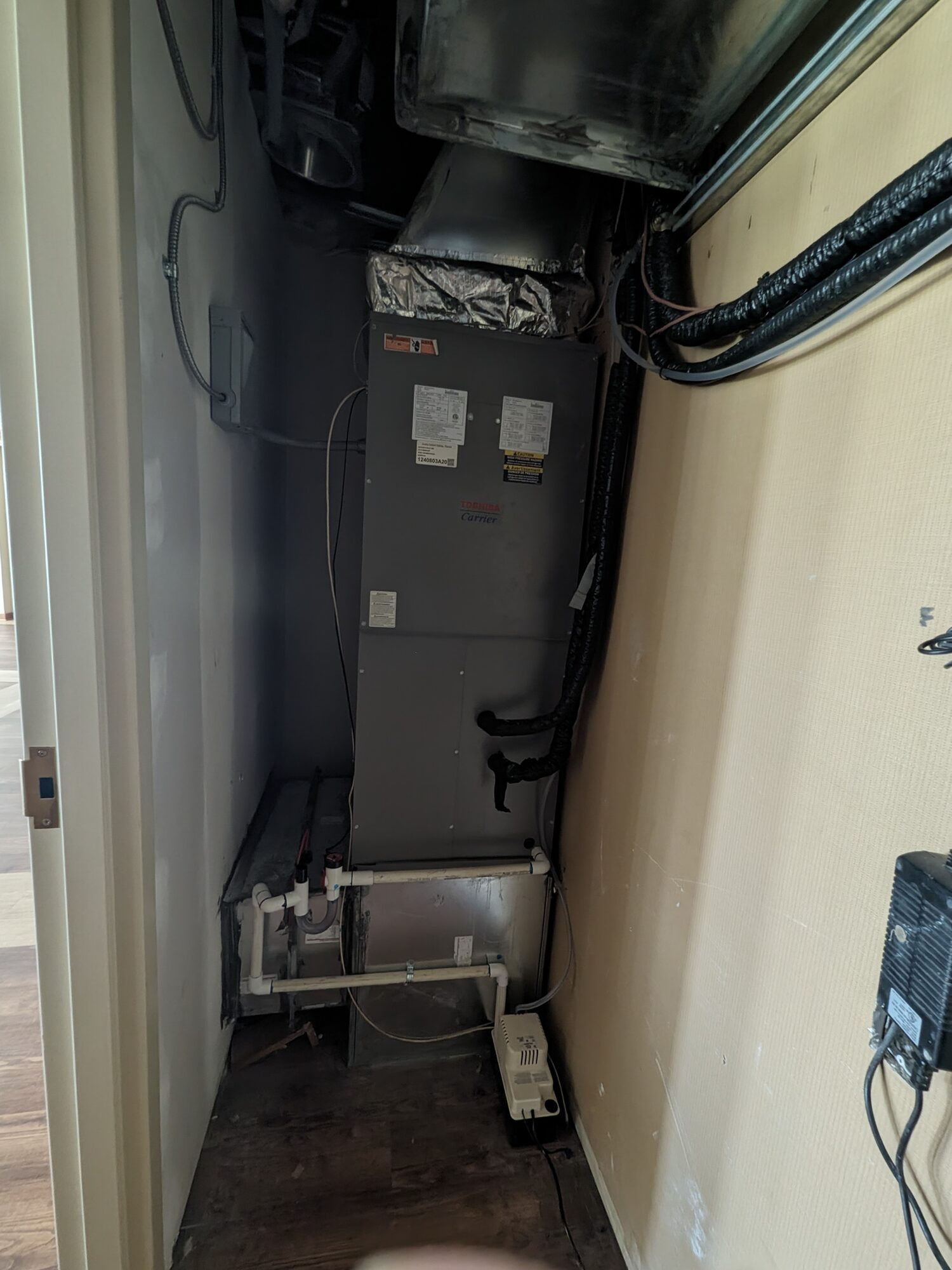 Toshiba-Carrier ducted VRF air handler installed in a mechanical closet